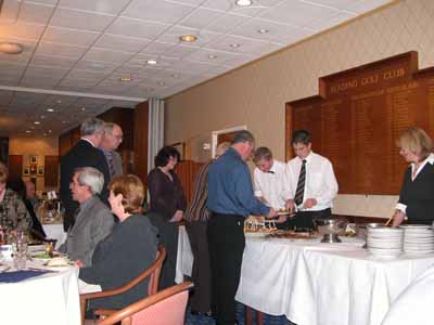 Members and guests collecting starters for dinner