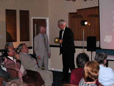 Geoff receives the Burke trophy from Don